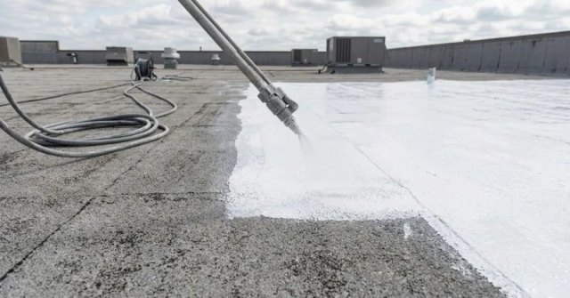 Homeowner documenting roof seams and sealant concerns