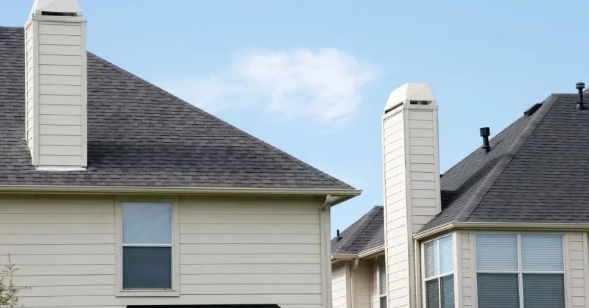 Residential home with asphalt roof shingles