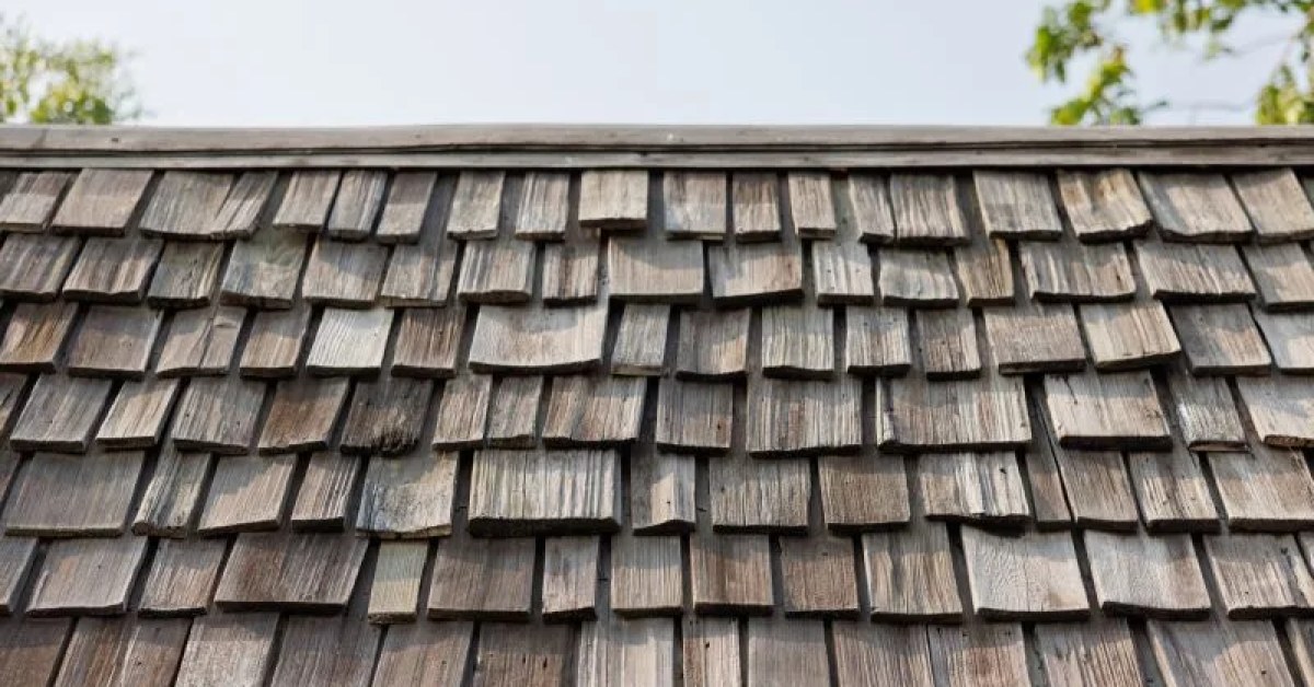 Shake roof with visible damaged sections prepared for repair