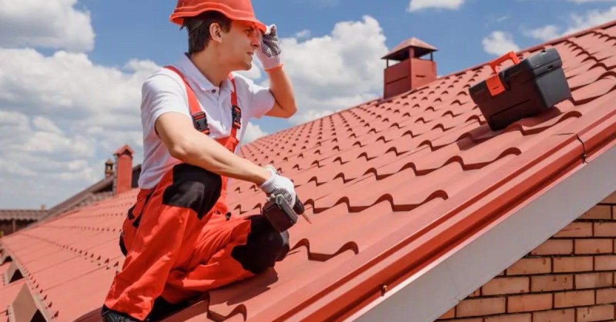 Tile roof with damaged and displaced tiles marked for repair